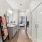 Bathroom with a big mirror, a large shower, a toilet, and white countertops