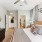Large bedroom with a nightstand, a dresser, and bathroom