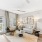 Large living space with couch and big windows